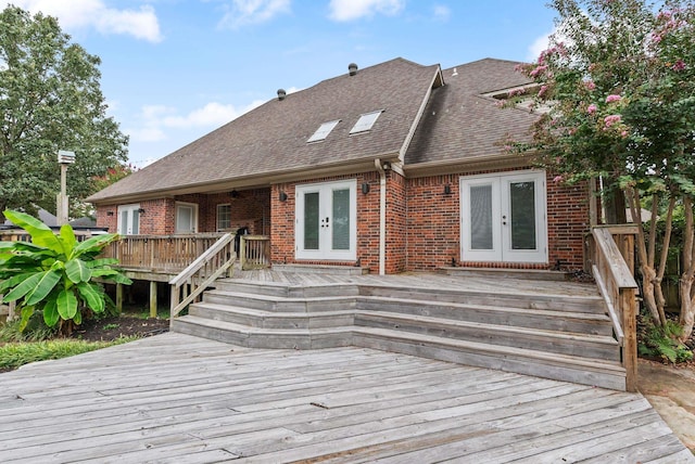 exterior space with french doors and a deck