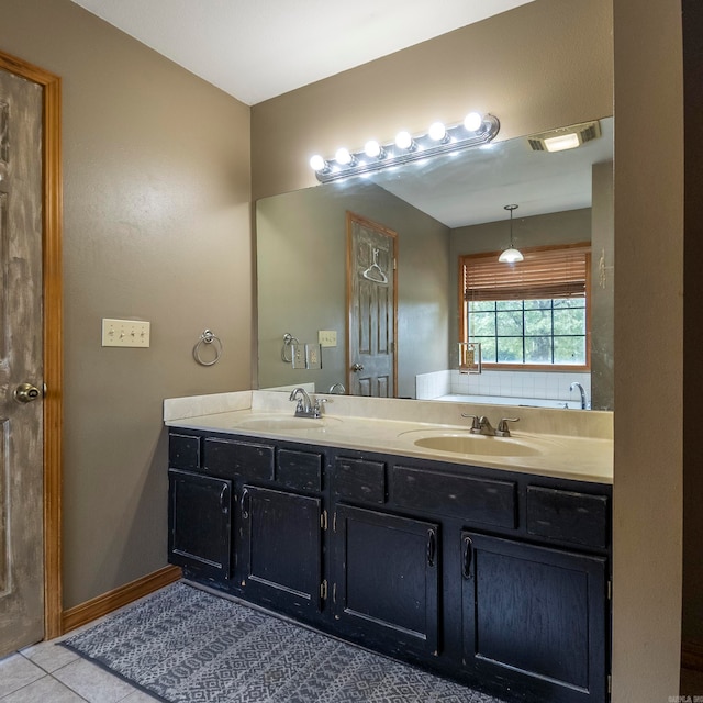 bathroom featuring tile patterned flooring and vanity