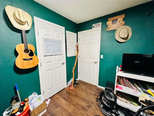 home office with wood-type flooring