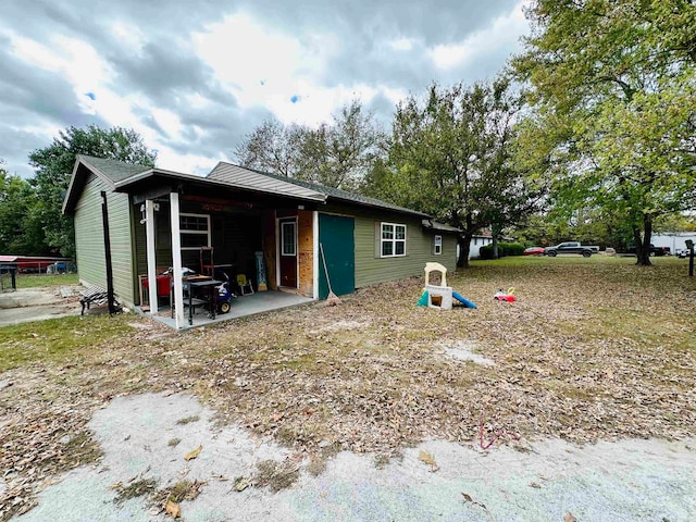 back of house with a patio