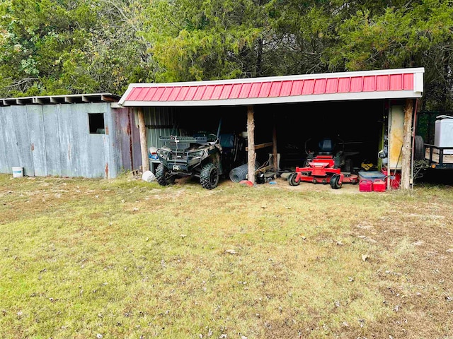 view of outbuilding featuring a yard