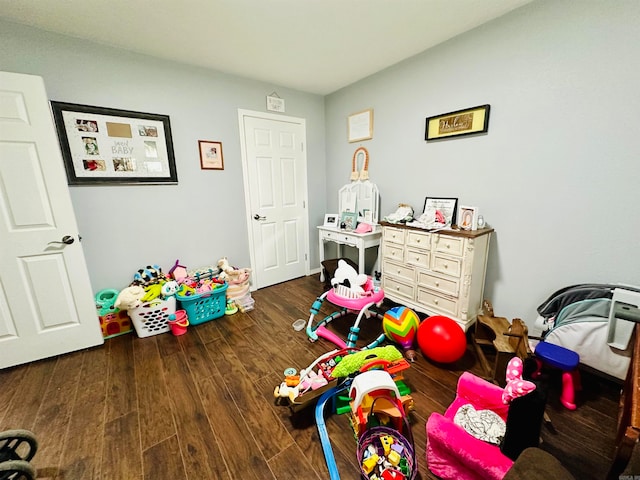 game room with dark hardwood / wood-style flooring