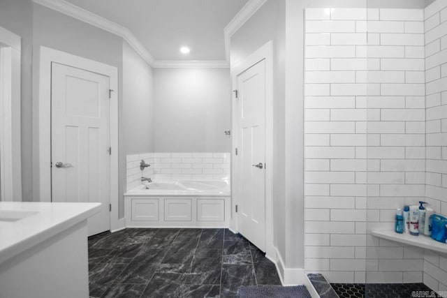 bathroom with vanity, a bathtub, and crown molding