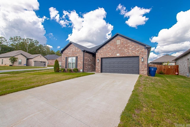 view of front of property with a front yard and a garage