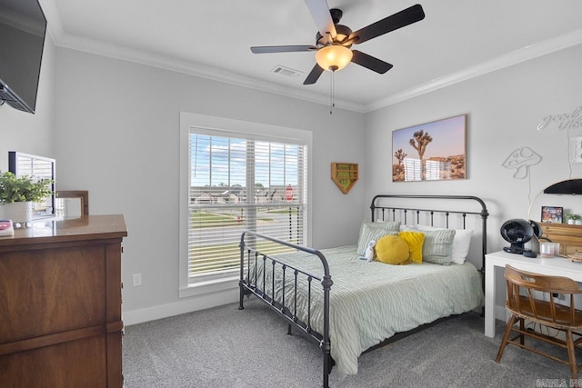 carpeted bedroom featuring ornamental molding and ceiling fan