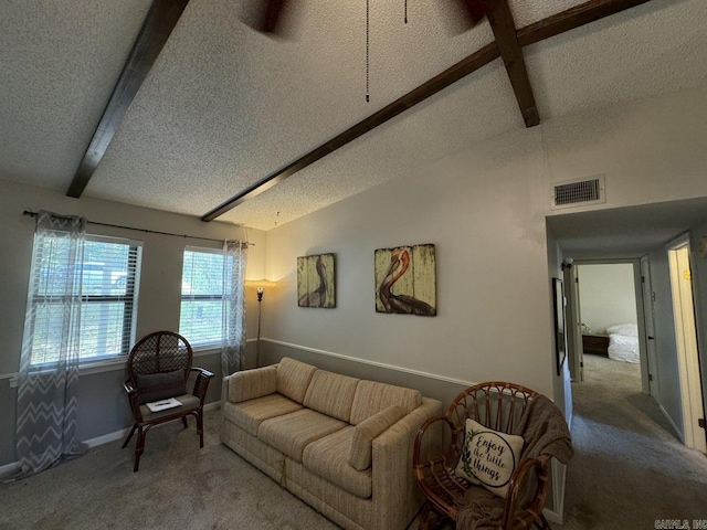 carpeted living room featuring a textured ceiling and lofted ceiling with beams