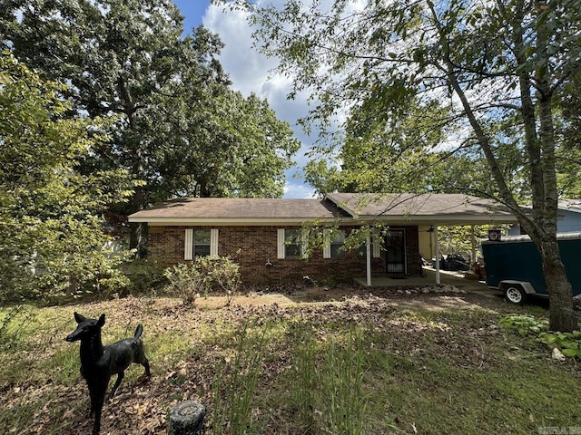 ranch-style home with a carport