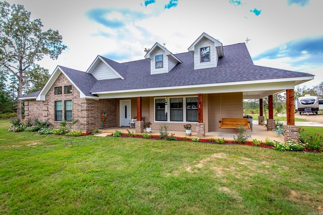 view of front facade featuring a front lawn and covered porch