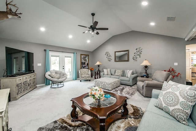 living room featuring ceiling fan, light colored carpet, lofted ceiling, and french doors