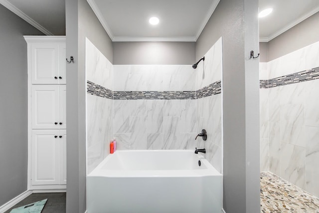 bathroom with crown molding and tiled shower / bath combo