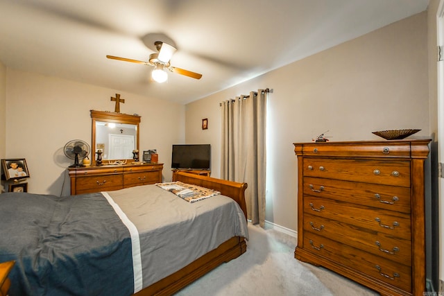 bedroom featuring light carpet and ceiling fan