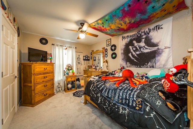 bedroom with ceiling fan and carpet flooring