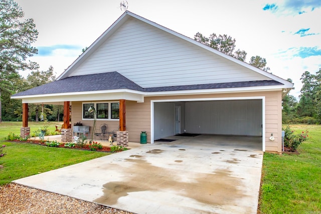 view of front facade with a front yard, a garage, and a carport