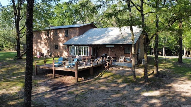 rear view of house with a deck