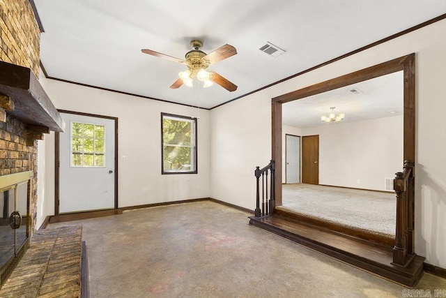 unfurnished living room with ceiling fan with notable chandelier, a brick fireplace, and crown molding