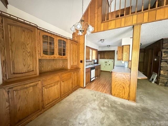 kitchen with dishwasher, light hardwood / wood-style floors, a chandelier, and decorative light fixtures