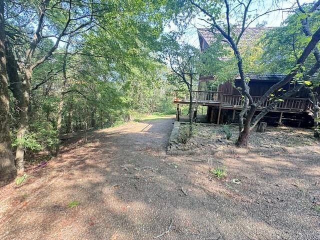 view of yard with a wooden deck