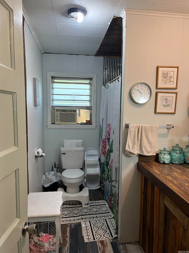 bathroom featuring walk in shower, cooling unit, toilet, and wood-type flooring