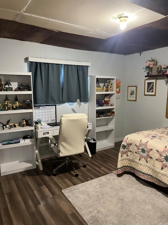 bedroom featuring dark hardwood / wood-style flooring