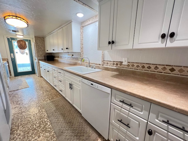 kitchen with tasteful backsplash, white cabinets, dishwasher, a textured ceiling, and sink