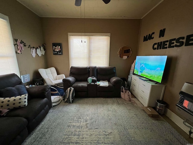 carpeted living room featuring ceiling fan