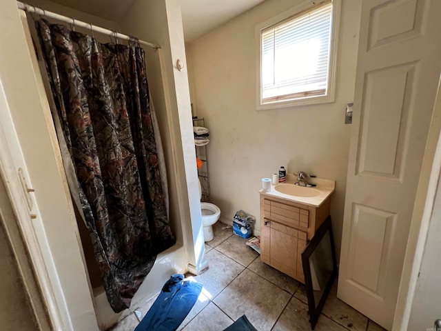 bathroom with curtained shower, tile patterned flooring, vanity, and toilet