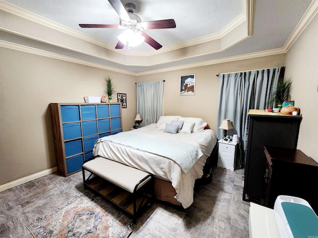 bedroom with ornamental molding, ceiling fan, and a raised ceiling