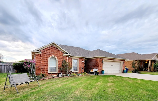 single story home with a front yard and a garage