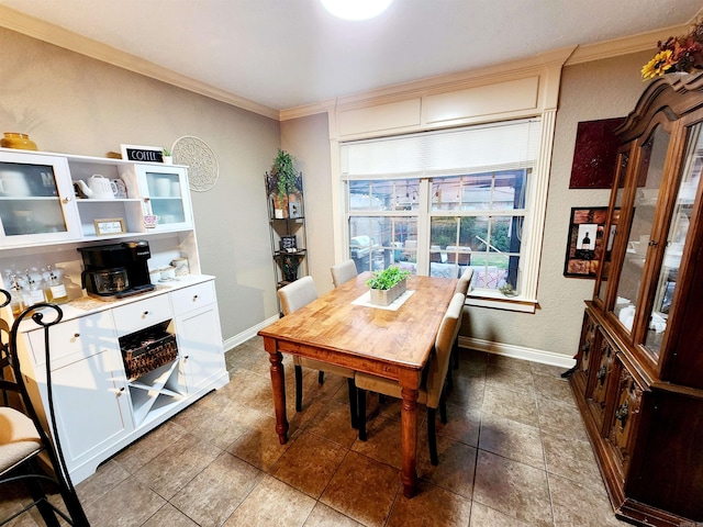 dining area featuring ornamental molding