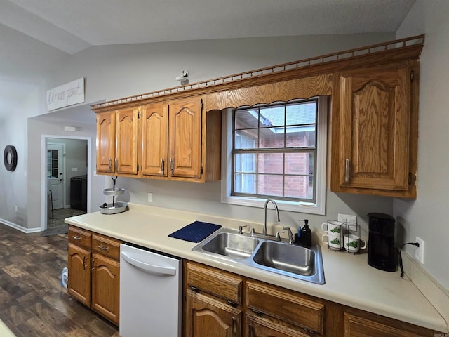 kitchen featuring vaulted ceiling, dishwasher, dark wood-type flooring, and sink