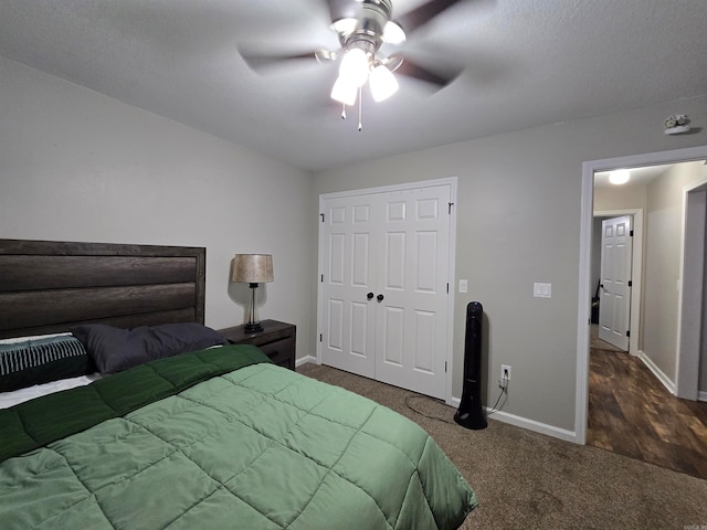 bedroom with dark carpet, a closet, and ceiling fan