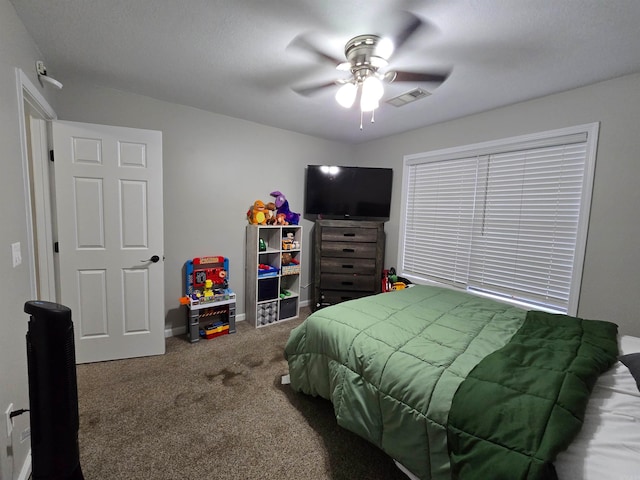 bedroom featuring ceiling fan and carpet floors