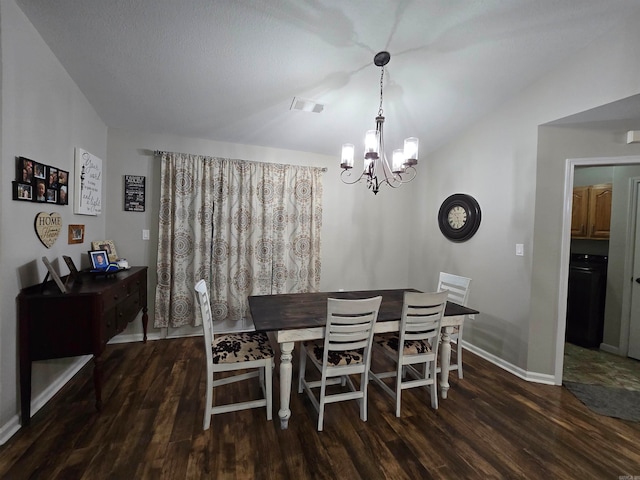 dining area featuring an inviting chandelier and dark hardwood / wood-style floors