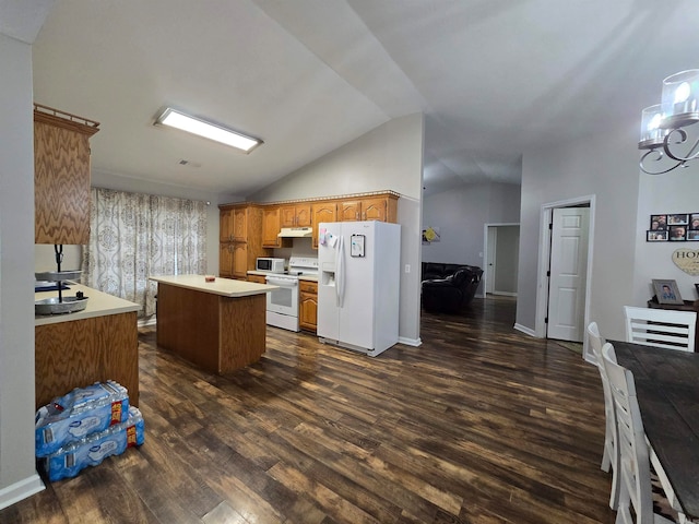 kitchen featuring dark hardwood / wood-style floors, vaulted ceiling, white appliances, and a kitchen island