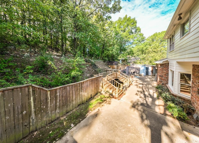 view of patio featuring fence