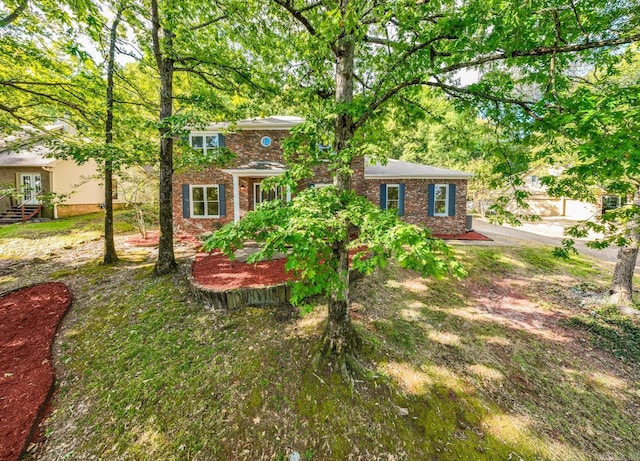 view of front of property featuring brick siding