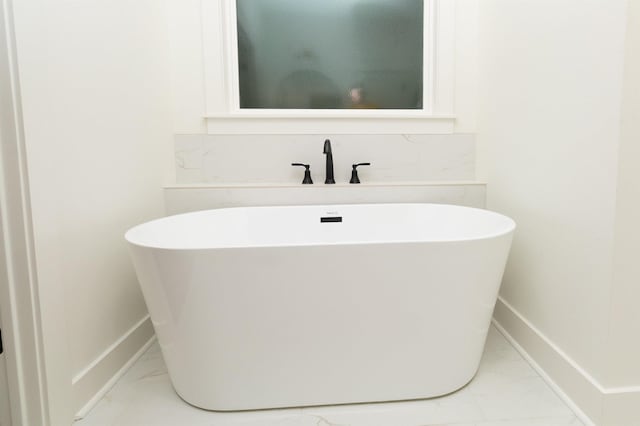 bathroom featuring a tub to relax in