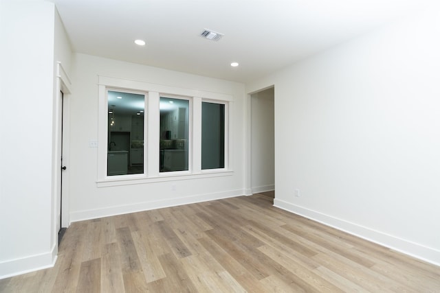 empty room with light hardwood / wood-style floors