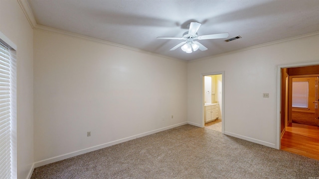 interior space featuring ornamental molding and ceiling fan