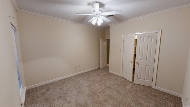 unfurnished bedroom with crown molding, light carpet, and ceiling fan