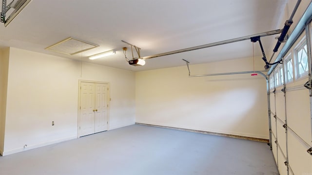 garage featuring a garage door opener