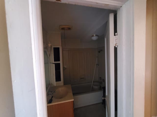 bathroom featuring shower / washtub combination and vanity