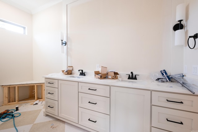 bathroom with vanity and crown molding