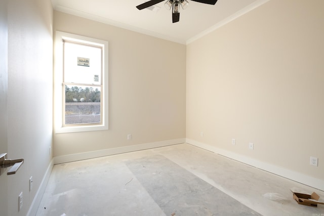 empty room featuring ceiling fan and crown molding