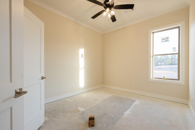 spare room featuring ornamental molding and ceiling fan