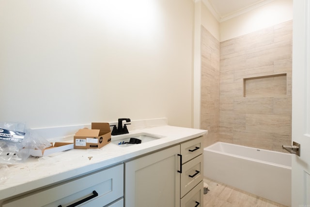 bathroom featuring a washtub, vanity, and crown molding