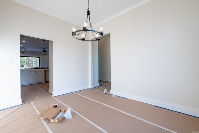 unfurnished dining area with ceiling fan with notable chandelier