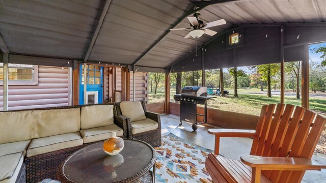 sunroom featuring wood ceiling, lofted ceiling, and ceiling fan