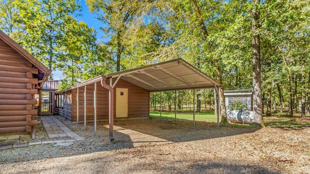 view of vehicle parking with a carport