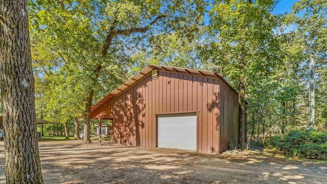 garage featuring wooden walls